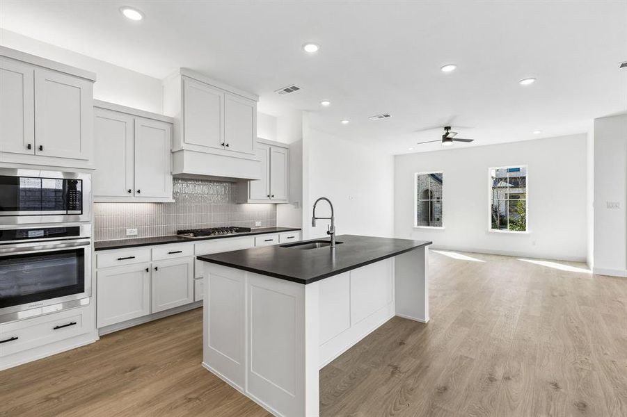 Your fantastic new kitchen features an oversized island perfect for friends and family to gather round!