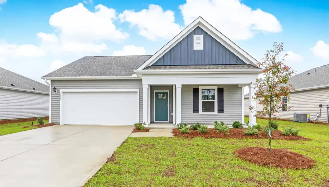 Front exterior of a new home in Driftwood, Richlands, NC, highlighting curb appeal (Image 1). Front exterior of a new home in Driftwood, Richlands, NC, highlighting curb appeal (Image 1).