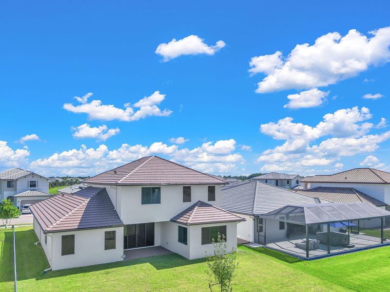 Front exterior of a new home in , Ave Maria, FL, highlighting curb appeal (Image 35).