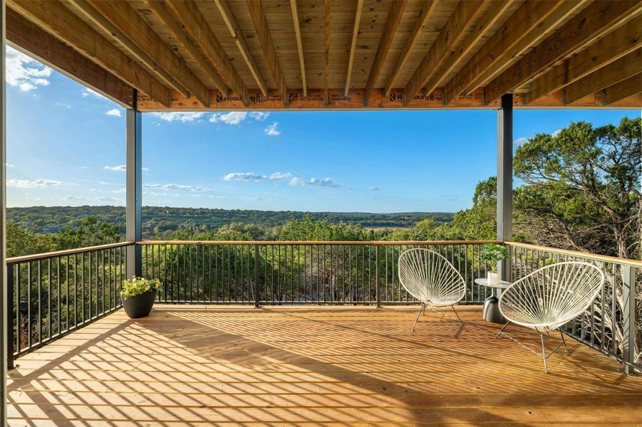 This lower level balcony provides additional outdoor living space under the cover of the main floor balcony.