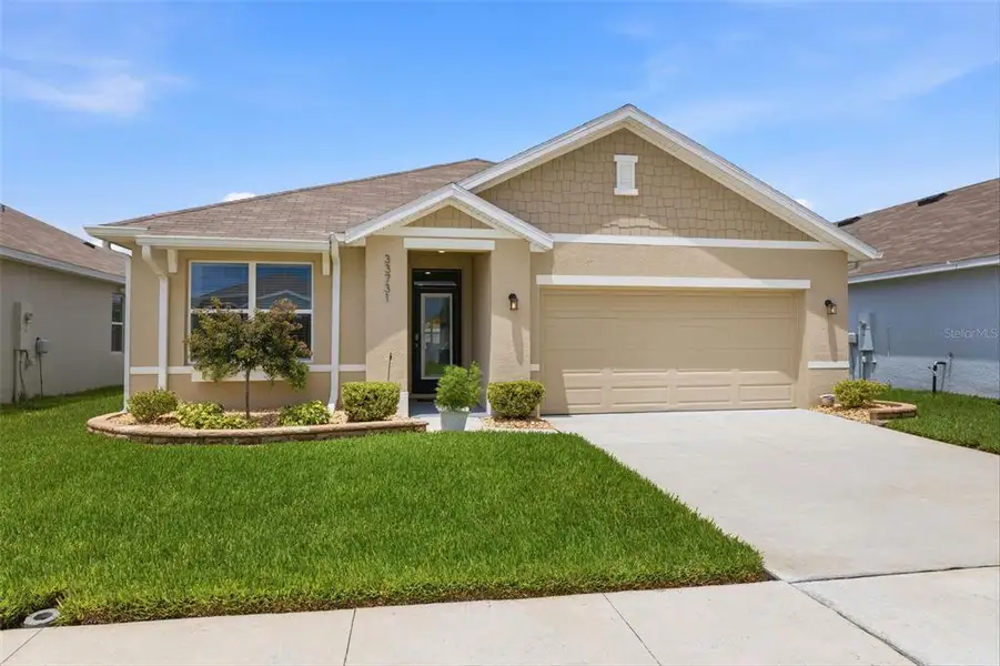 Front exterior of a new home in , Wesley Chapel, FL, highlighting curb appeal (Image 2). Front exterior of a new home in , Wesley Chapel, FL, highlighting curb appeal (Image 2).