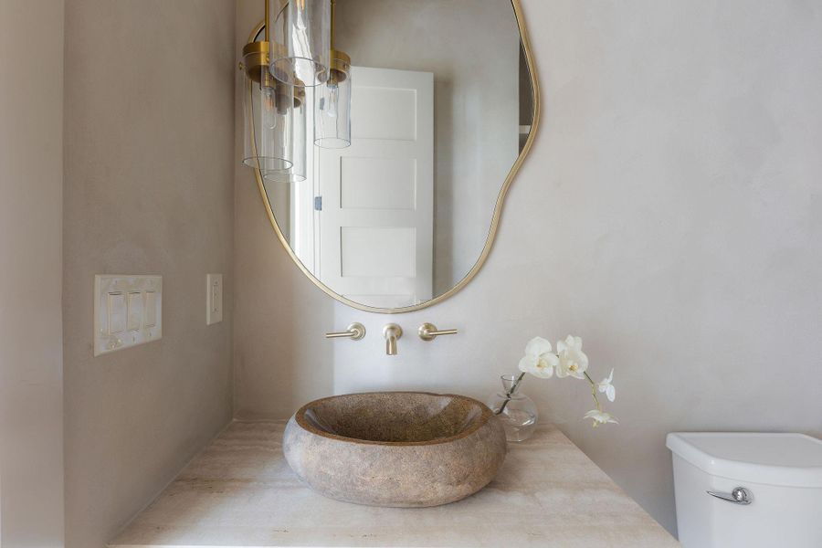 Gorgeous half bathroom downstairs for guests