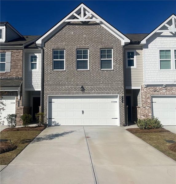 Front exterior of a new home in Union Village, McDonough, GA, highlighting curb appeal (Image 1).