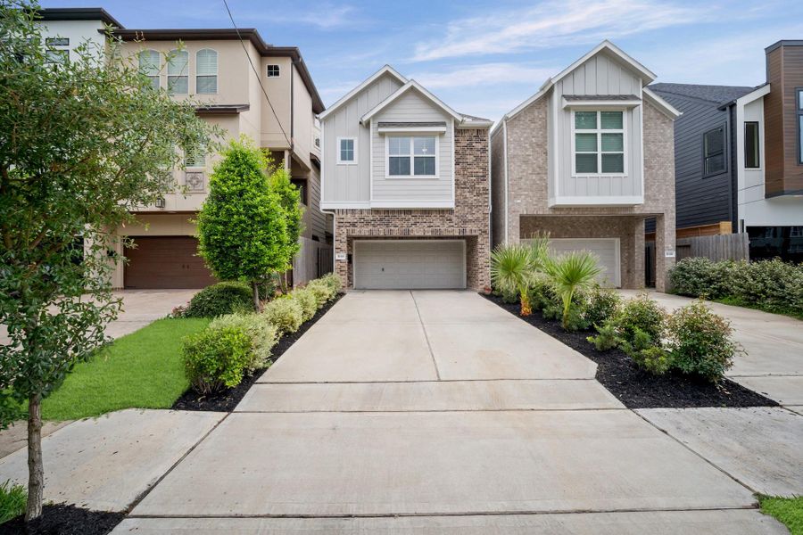 Brick façade, fresh landscaping, and a deep private driveway with room for four cars — plus two more in the attached garage. Parking is never the problem here. Brick façade, fresh landscaping, and a deep private driveway with room for four cars — plus two more in the attached garage. Parking is never the problem here.