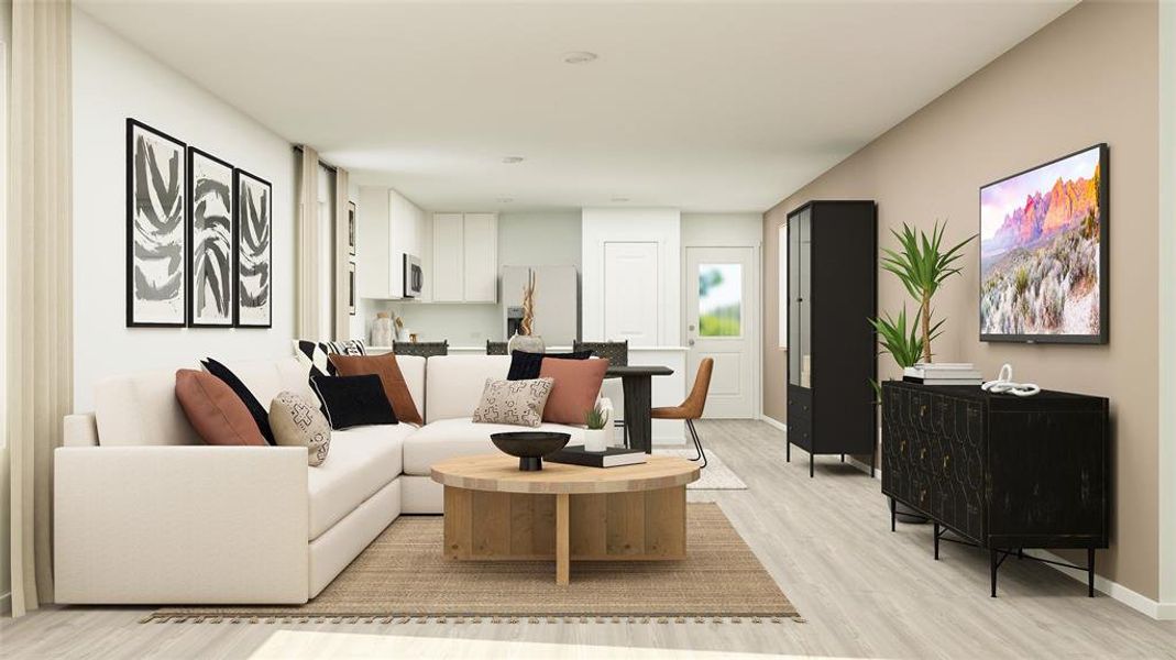 Expansive open-concept living area featuring light wood-finish flooring, a contemporary kitchen with white cabinetry and stainless steel appliances, and a dedicated dining space Expansive open-concept living area featuring light wood-finish flooring, a contemporary kitchen with white cabinetry and stainless steel appliances, and a dedicated dining space