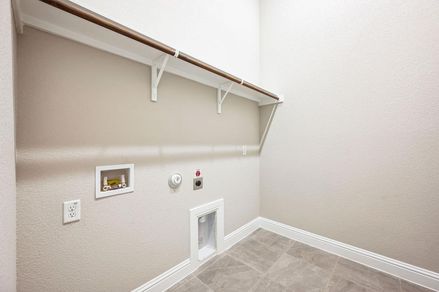 Laundry room with washer hookup, gas dryer hookup, electric dryer hookup, laundry area, and baseboards Laundry room with washer hookup, gas dryer hookup, electric dryer hookup, laundry area, and baseboards