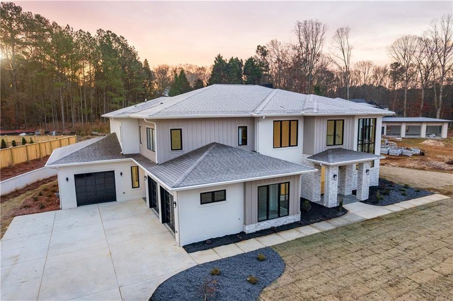 Front exterior of a new home in , Suwanee, GA, highlighting curb appeal (Image 1).
