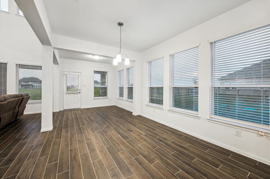 Discover the large, versatile breakfast room that seamlessly transitions into a sunroom, offering an abundance of natural light and a warm atmosphere. This adaptable space can easily serve as a full dining room, making it perfect for both casual meals and formal gatherings, ensuring you have the perfect setting for every occasion.