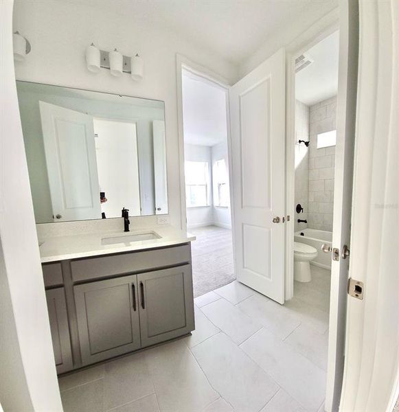 Furnished interior view inside a new home in Laureate Park, Orlando (Image 13).