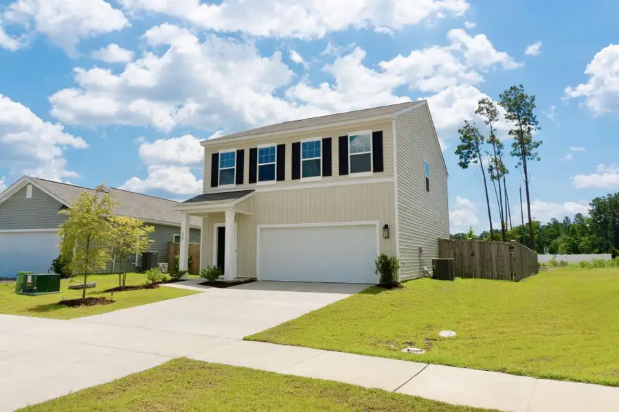 Front exterior of a new home in , Summerville, SC, highlighting curb appeal (Image 1). Front exterior of a new home in , Summerville, SC, highlighting curb appeal (Image 1).