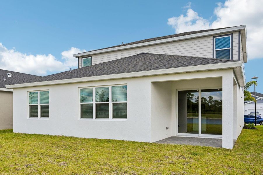 Exterior details and patio area of a home in Brystol at Wylder - Reserve Series, Port St. Lucie (Image 27).