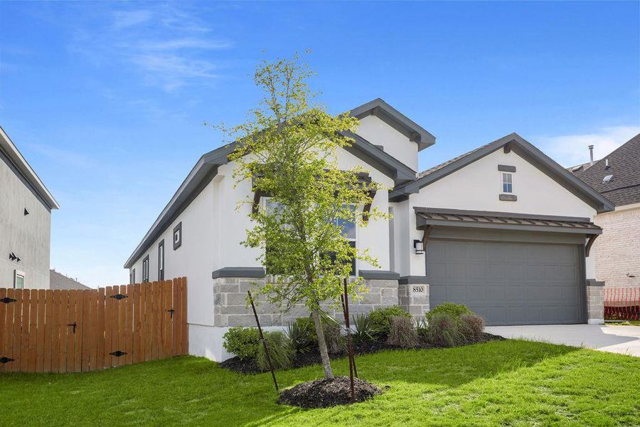 Modern home exterior with lush green lawn and inviting curb appeal. Modern home exterior with lush green lawn and inviting curb appeal.