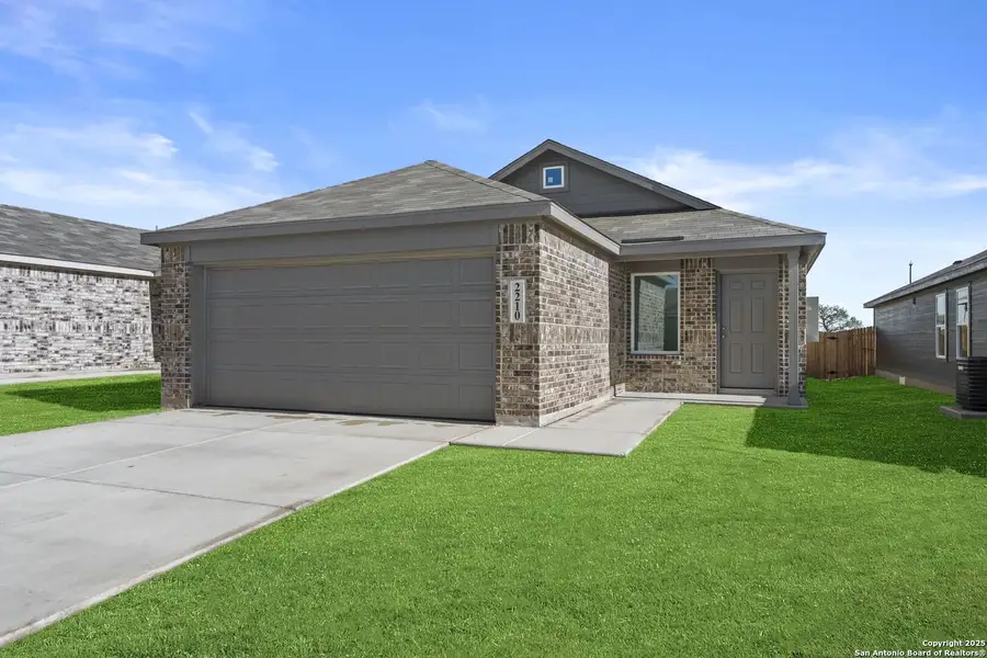 Front exterior of a new home in Randolph Crossing: Cottage Collection, Converse, TX, highlighting curb appeal (Image 1).