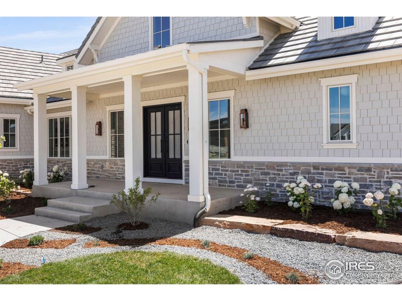 Front exterior of a new home in , Berthoud, CO, highlighting curb appeal (Image 22).