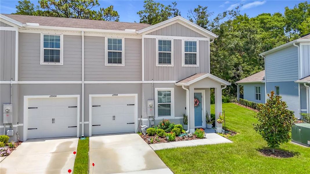 Front exterior of a new home in , New Port Richey, FL, highlighting curb appeal (Image 24).