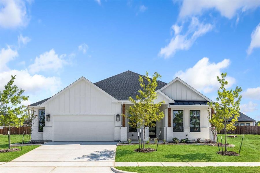 Front exterior of a new home in University Park at Northpointe, Denton, TX, highlighting curb appeal (Image 1).