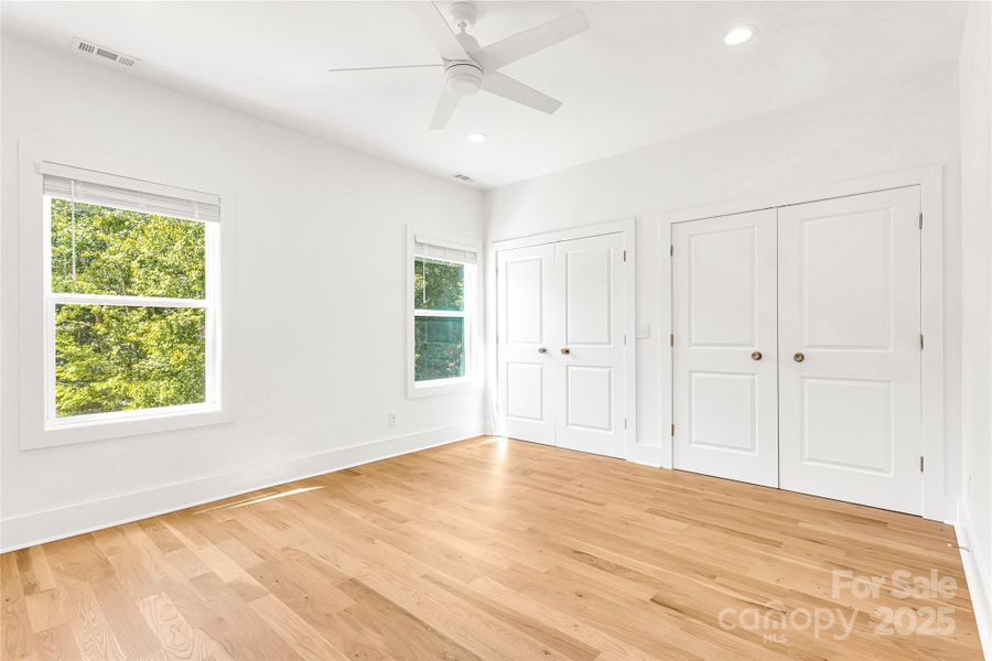Bedroom ensuite off hallway with separate closets