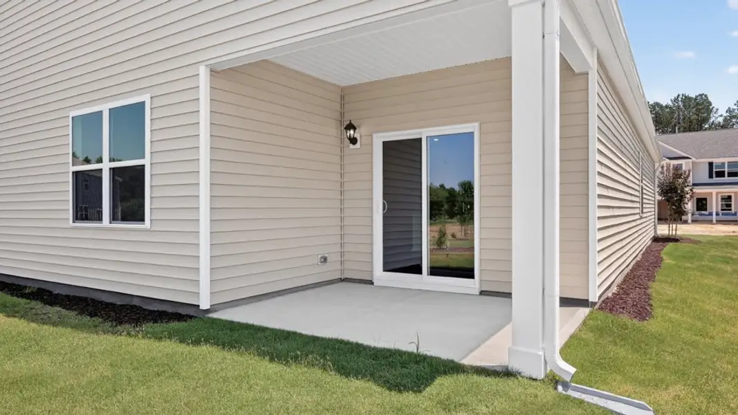 Exterior details and patio area of a home in The Grove at Matthews Landing, Fuquay Varina (Image 3).