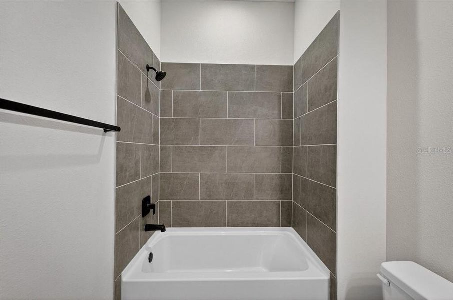 Furnished interior view inside a new home in Stables at Cary Forest, Bryceville (Image 13).