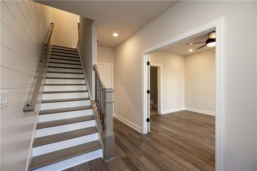 Step into a welcoming foyer that sets the tone for this modern home, featuring clean lines, natural light, and a seamless flow into the open living space.  This photo is from another community and not representative of this homesite.