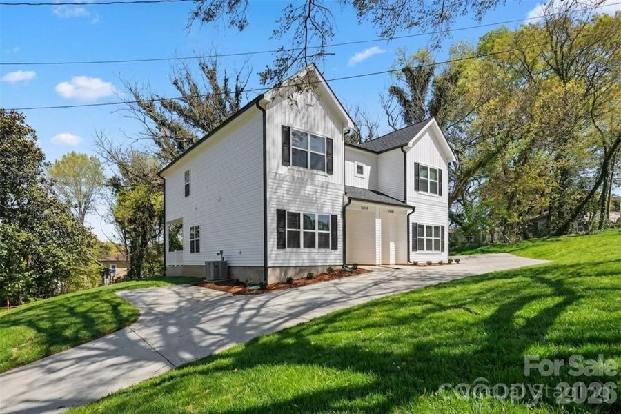 Front exterior of a new home in , Statesville, NC, highlighting curb appeal (Image 26).