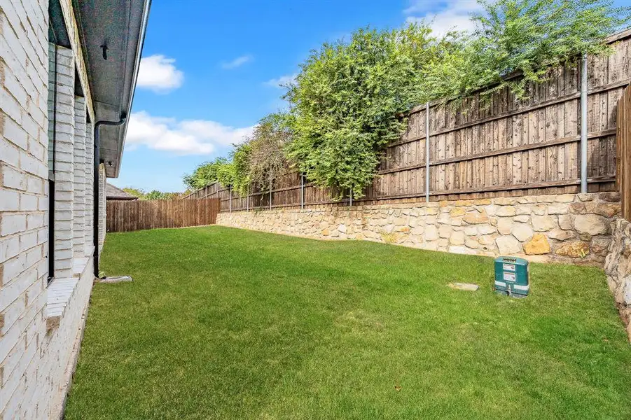 View of fenced backyard