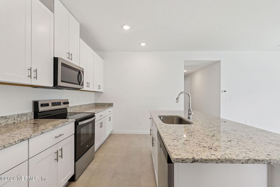 Furnished interior view inside a new home in Lakes at Bella Lago - Signature Series, Green Cove Springs (Image 7).