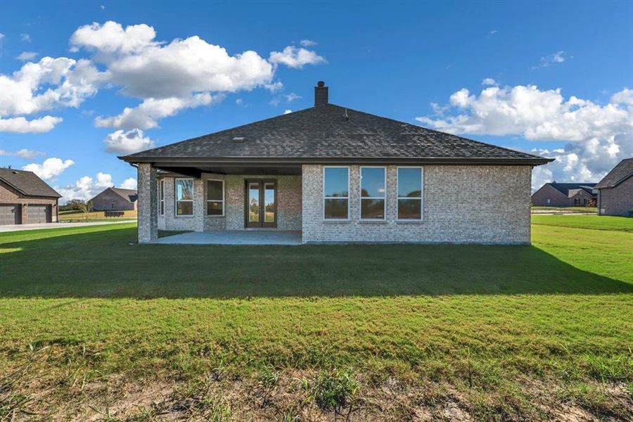 Front exterior of a new home in Fannin Ranch, Leonard, TX, highlighting curb appeal (Image 23). Front exterior of a new home in Fannin Ranch, Leonard, TX, highlighting curb appeal (Image 23).
