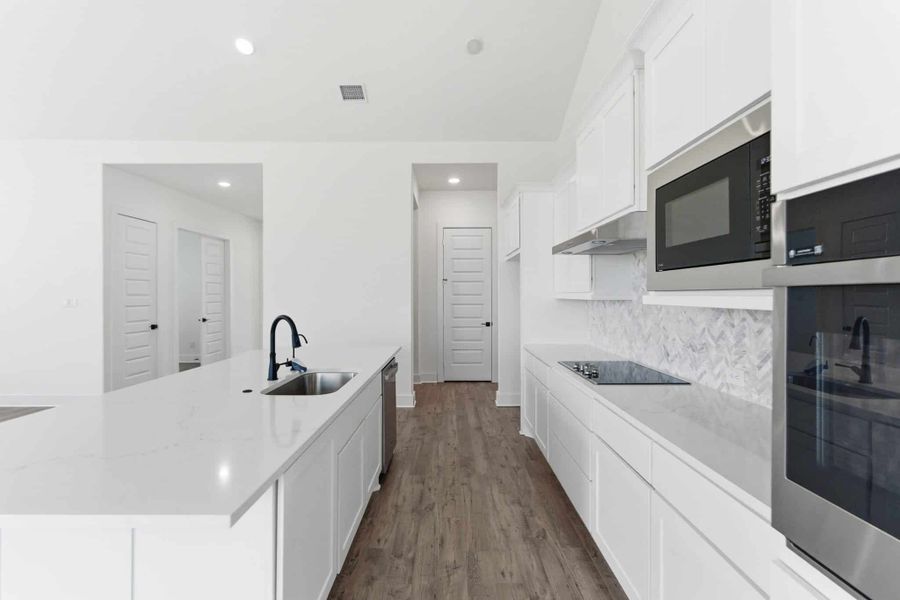 Representative furnished interior of a home built from the Malibu by Chesmar Homes in Sienna Lakes, San Antonio (Image 6).