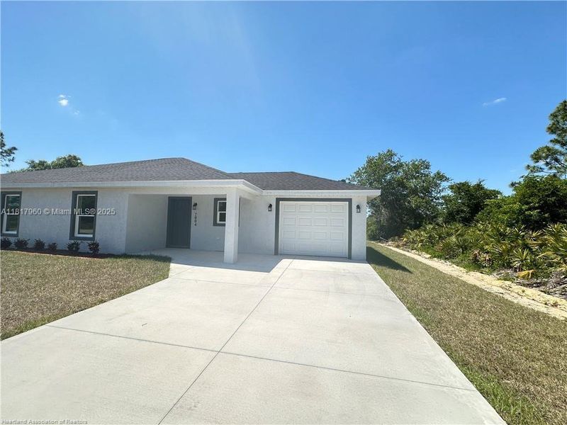 Front exterior of a new home in , Sebring, FL, highlighting curb appeal (Image 11).