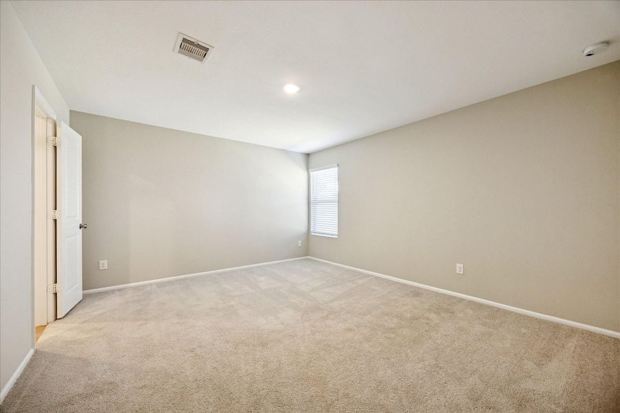 Primary Bedroom is split from the other 3 bedrooms and study, with an ensuit bath and large walk-in closet