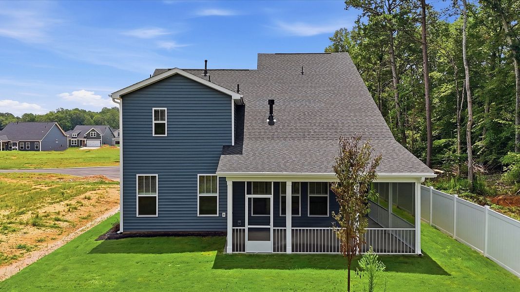Superior curb appeal continues to the back with a refined, covered outdoor living space located in Woodruff, SC