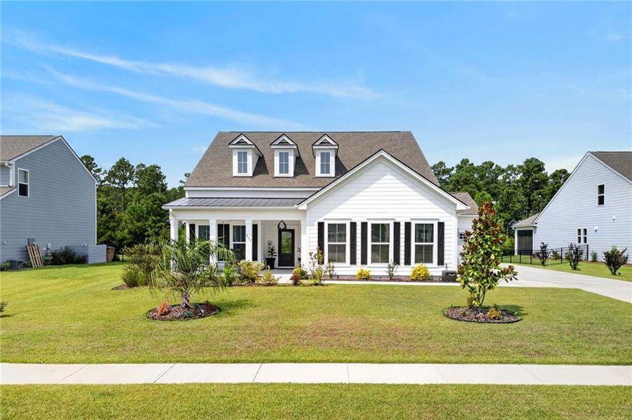 Front exterior of a new home in , Richmond Hill, GA, highlighting curb appeal (Image 27). Front exterior of a new home in , Richmond Hill, GA, highlighting curb appeal (Image 27).
