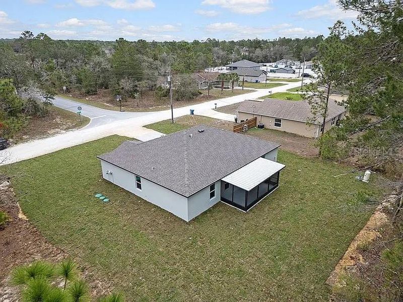 Exterior details and patio area of a home in Royal Highlands, Brooksville (Image 21).
