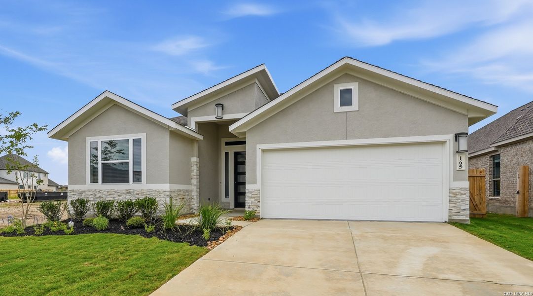Front exterior of a new home in Alsatian Oaks, Castroville, TX, highlighting curb appeal (Image 2). Front exterior of a new home in Alsatian Oaks, Castroville, TX, highlighting curb appeal (Image 2).