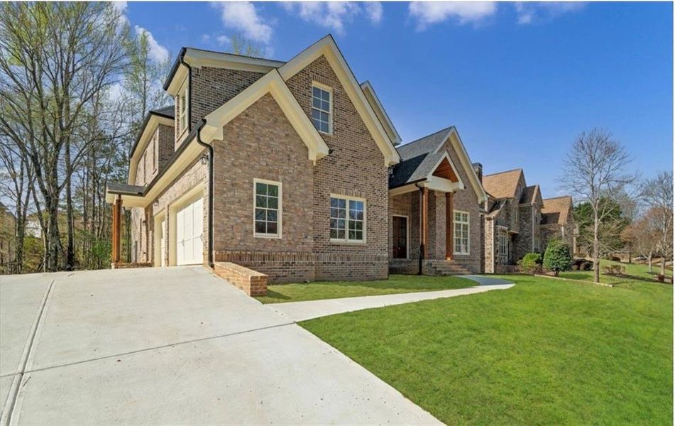 Front exterior of a new home in Brookmont, Douglasville, GA, highlighting curb appeal (Image 26).