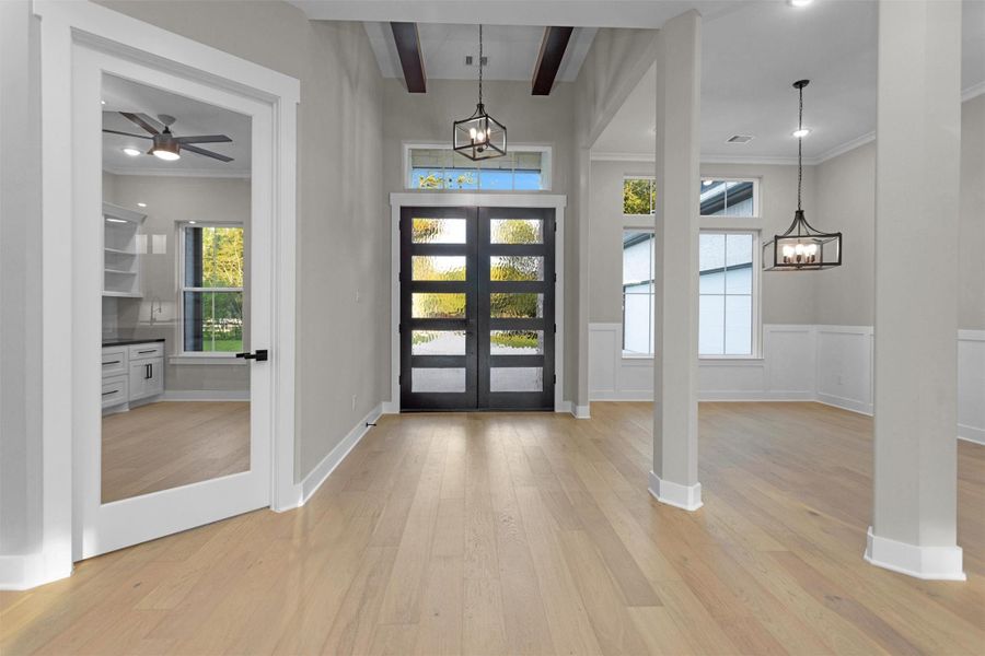 Welcoming foyer with soaring ceilings and natural light that sets the tone for luxury living. Welcoming foyer with soaring ceilings and natural light that sets the tone for luxury living.