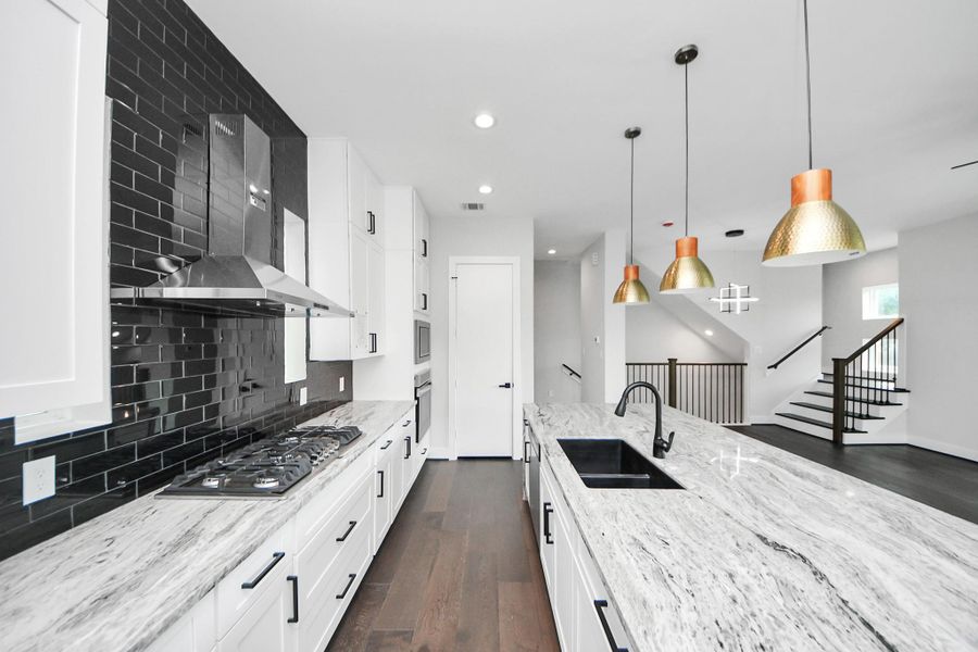 Chef’s kitchen with oversized island and seating