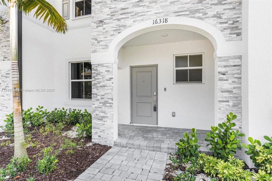 Exterior details and patio area of a home in Cedar Pointe: Cypress Collection, Homestead (Image 4). Exterior details and patio area of a home in Cedar Pointe: Cypress Collection, Homestead (Image 4).