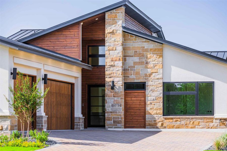 Front exterior of a new home in , Horseshoe Bay, TX, highlighting curb appeal (Image 25). Front exterior of a new home in , Horseshoe Bay, TX, highlighting curb appeal (Image 25).