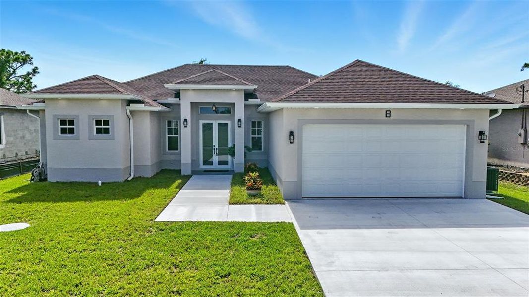 Front exterior of a new home in , Placida, FL, highlighting curb appeal (Image 22). Front exterior of a new home in , Placida, FL, highlighting curb appeal (Image 22).
