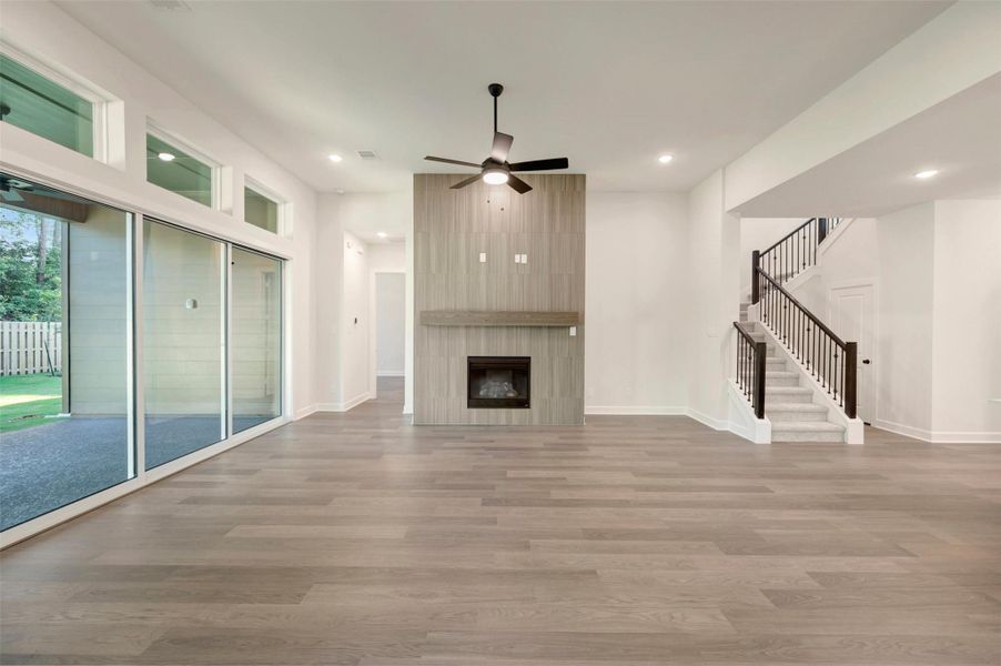WOW!  This is an impressive Living area with the 12 ft ceilings and gorgeous accent wall with fireplace tiled to ceiling and cedar block mantle!