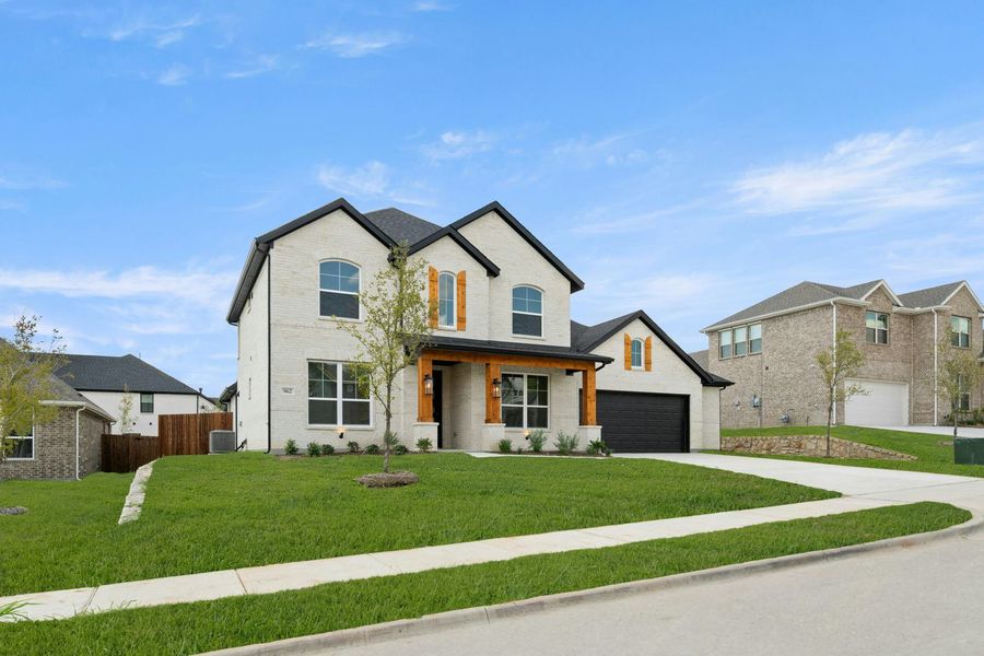Front exterior of a new home in Kentsdale Farms, DeSoto, TX, highlighting curb appeal (Image 22).