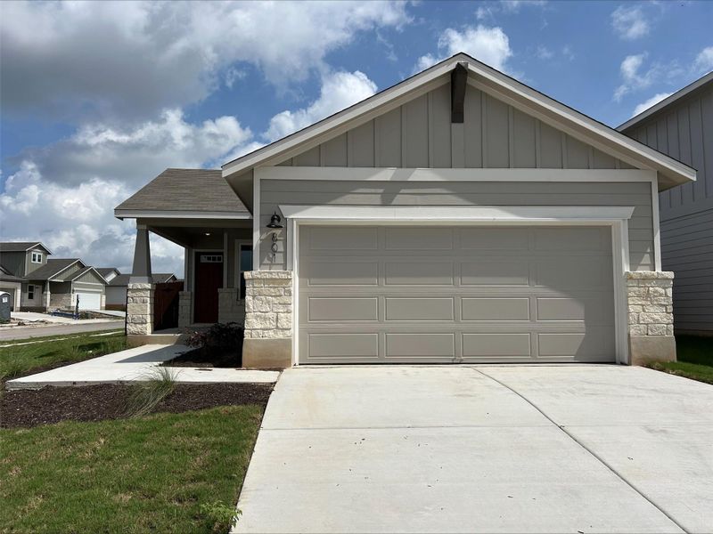 Front exterior of a new home in MorningStar - Americana Collection, Georgetown, TX, highlighting curb appeal (Image 19).