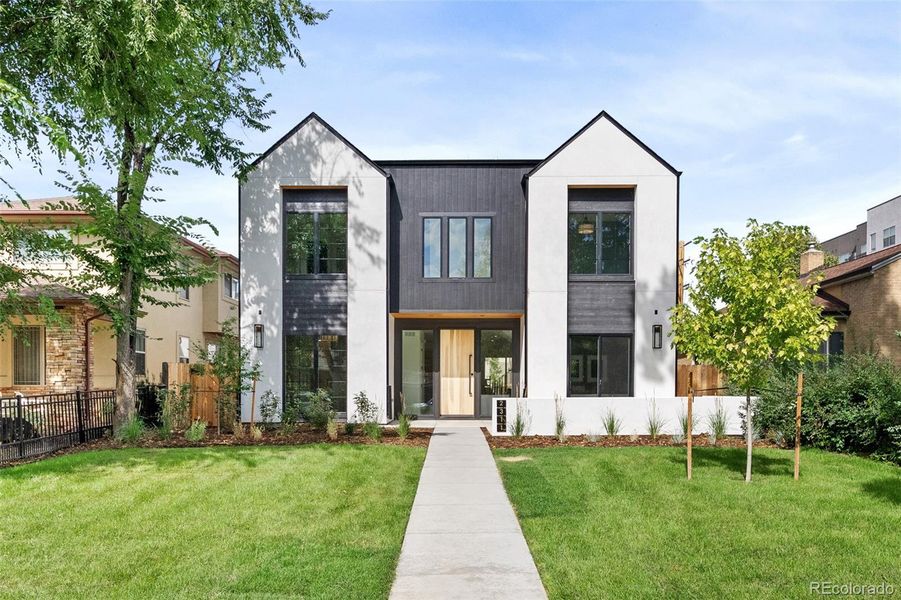 2311 S Josephine offers 5 en suite beds + 7 baths on an oversized lot