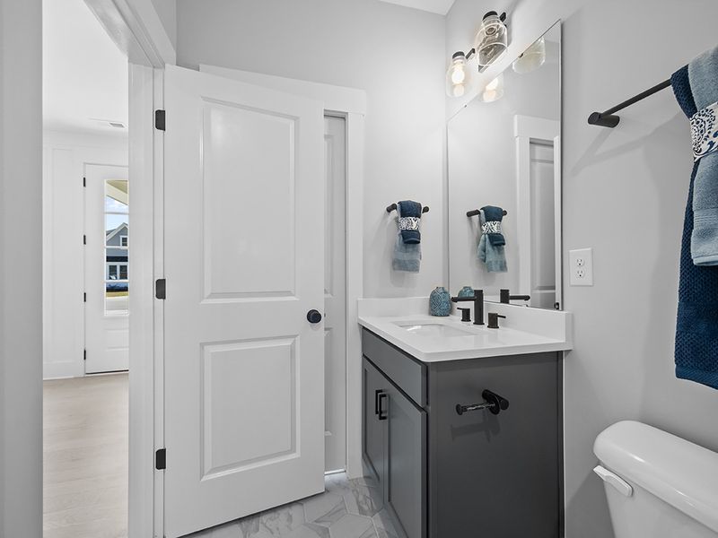 Representative furnished interior of a home built from the The Hampton by RobuckHomes in Windwater, Hampstead (Image 15).