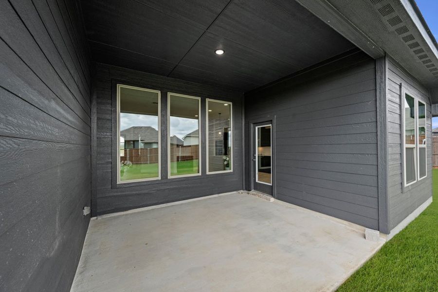 Representative exterior photo of a completed home built from the Balmoral by Impression Homes in Timberbrook, Justin, TX (Image 23).