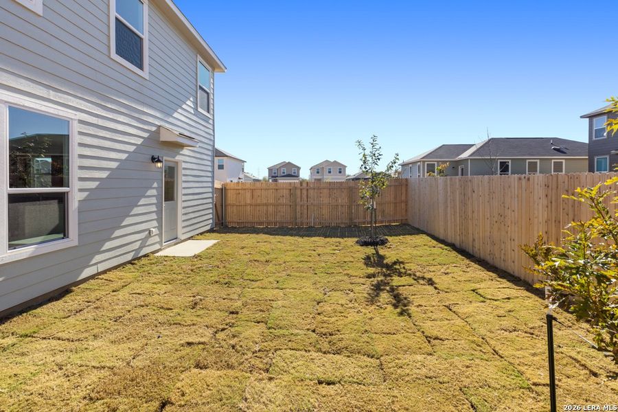 Exterior details and patio area of a home in Southton Cove, Elmendorf (Image 4).