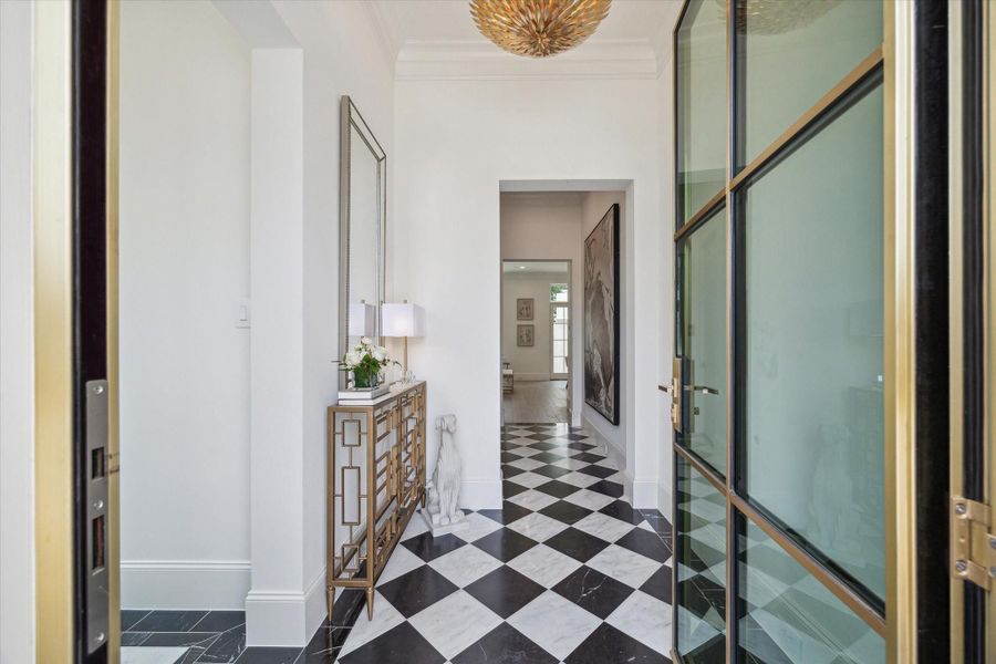 Buyers can choose to upgrade from solid African Mahogany front door to a steel and glass door with dozens of different finishes for the metal. *Photo is of another home in the community and for informational purposes only.