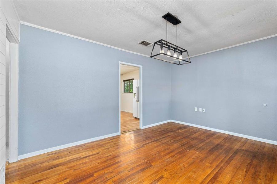 Dining room at front of house with decorative lighting Dining room at front of house with decorative lighting